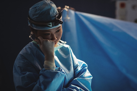 Female surgeon in operation room at the hospitalの写真素材