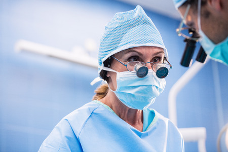 Surgeons performing operation in operation room at the hospital
