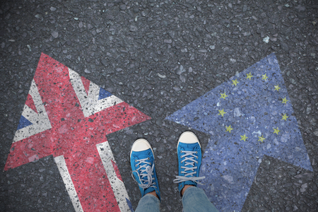 Casual shoes against close-up of european flagの写真素材