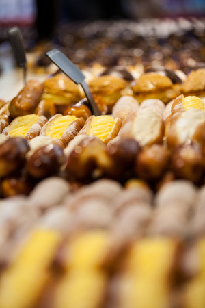 Close-up of baguettes arranged in display at supermarketの写真素材