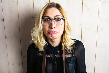 Portrait of beautiful woman posing against texture backgroundの写真素材