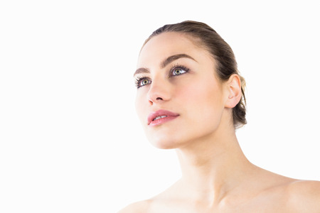 Close-up of beautiful woman posing against white backgroundの写真素材