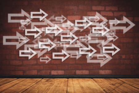 composite of arrow graphics over wall and wood backgrondの写真素材