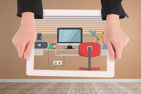 composite of hands holding tablet computer with graphicsの写真素材