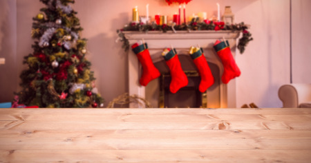 A light parquet against christmas tree with presents near the fireplaceの写真素材