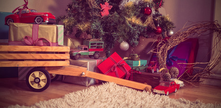 Christmas gifts and christmas tree in living room at homeの写真素材