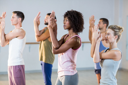 Group of people exercising in fitness studioの写真素材