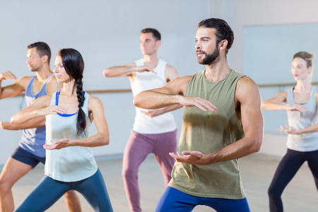 Group of people exercising in fitness studio