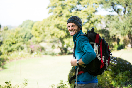 Portrait of smiling male hiker in forestの写真素材