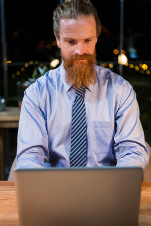 Businessman working on laptop in the officeの写真素材