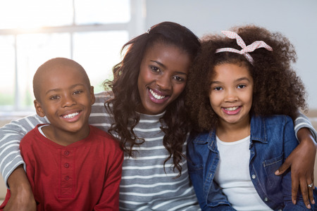 Portrait of mother with their children at homeの写真素材
