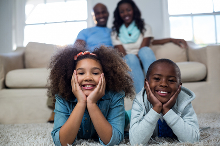 Portrait of children with their parents at homeの写真素材