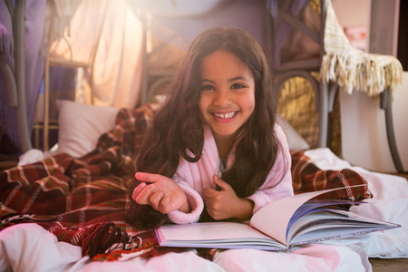 Portrait of girl relaxing on mattress at home