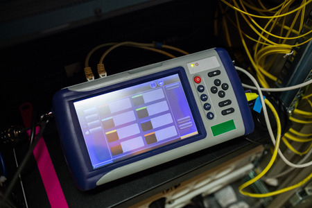 Close-up of digital cable analyzer in server roomの写真素材