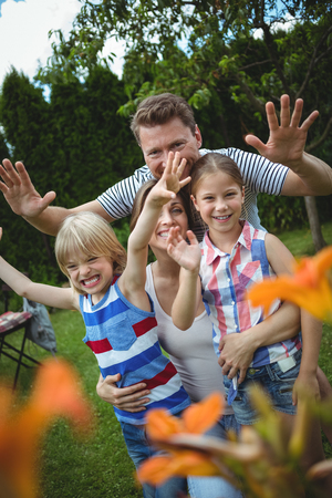 Happy family having fun in park on a sunny dayの写真素材