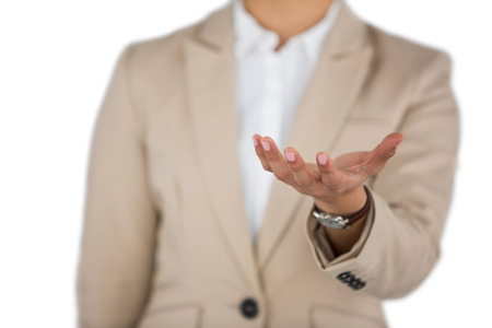 Mid-section of Businesswoman using digital screen against white backgroundの写真素材