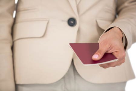 Midsection of Businesswoman holding passportの写真素材