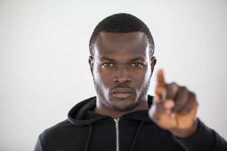 Hacker using digital screen against white backgroundの写真素材