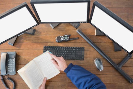 Security reading a novel at deskの写真素材