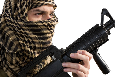 Soldier holding a rifle against white background