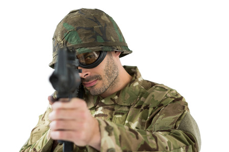 Soldier aiming with a rifle against white background