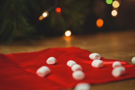 Sweet marshmallow on wooden table during christmas timeの写真素材