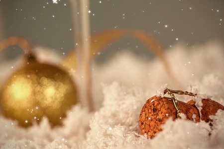Twinkling stars against champagne cork and christmas ornamentの写真素材
