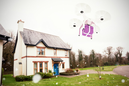 Snow falling against yard outside houseの写真素材