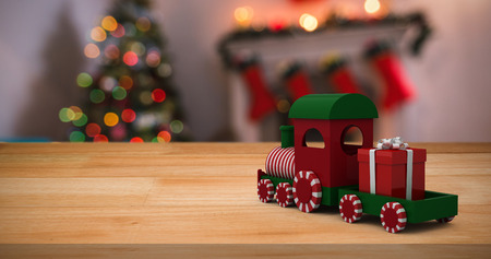 Miniature train against defocused of christmas tree lights and fireplaceの写真素材