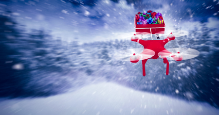 High angle view of drone pulling Chirstmas sledge against landscape of snowの写真素材