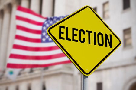 Election text against american flag on streetの写真素材