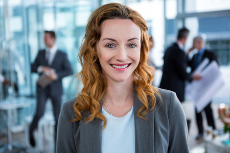 Portrait of smiling businesswoman in officeの写真素材