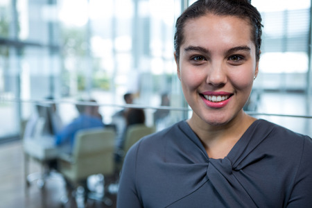 Portrait of smiling businesswoman in officeの写真素材