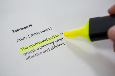 Close-up of marker pen highlighting text in a leadership paperの写真素材