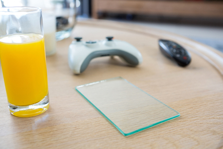 Juice with a piece of glass on a table at home