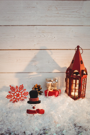Christmas decorations against wooden wall during christmas timeの写真素材