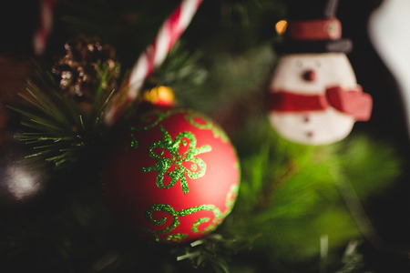 Close-up of decorations on christmas tree during christmas time at homeの写真素材