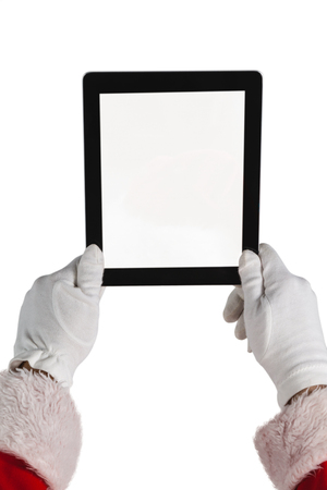 Santa claus holding digital tablet against white backgroundの写真素材