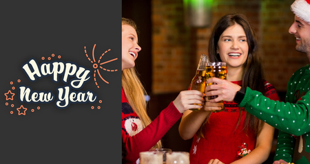 Cheerful friends having drinks during Christmas against print