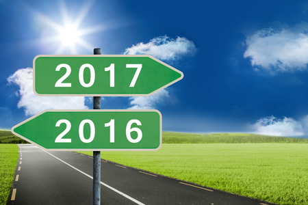 Digital image of new year 2017 against road leading out to the horizon