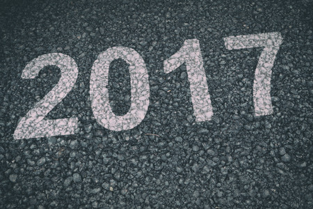 Happy New Year 2017 against black road