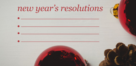 Composite image of new years resolution and decoration on wooden wallの写真素材
