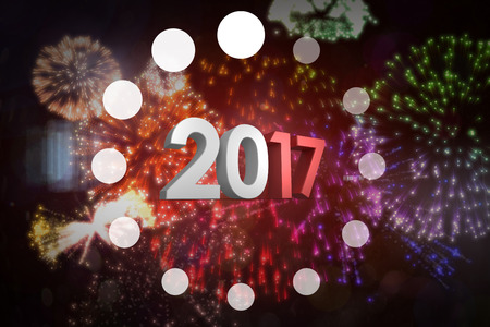 Graphic ring against colourful fireworks exploding on black background