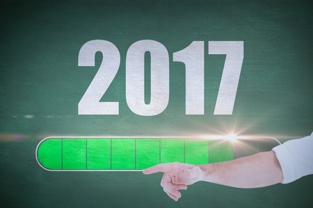 Businessmans hand pointing in shirt against green chalkboard