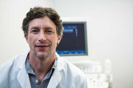 Portrait of doctor smiling at camera in hospitalの写真素材