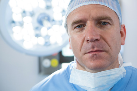 Portrait of male surgeon in operation theaterの写真素材