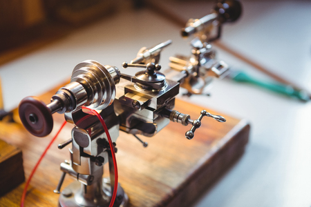 Close-up of clock repair machine in workshop