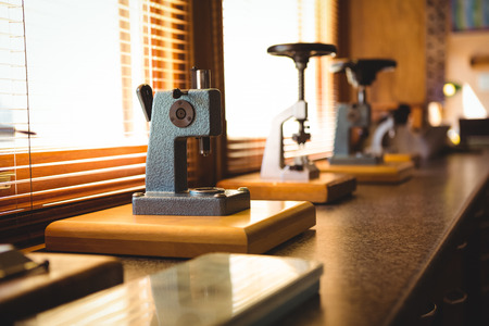 Watch in workshop placed on microscope for repairの写真素材