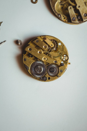 Clocks part on table in workshop