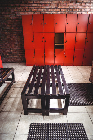 Empty locker room and a bench in fitness studioの写真素材